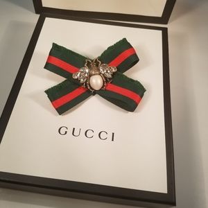 Red and green bee web brooch